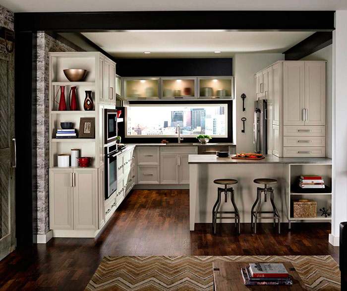 Grey cabinets in casual kitchen by Kitchen Craft Cabinetry