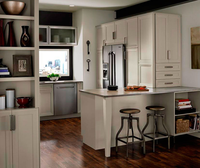 Grey cabinets in casual kitchen by Kitchen Craft Cabinetry