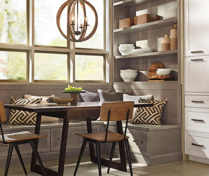 Dining area of a casual open kitchen design by Kitchen Craft Cabinetry