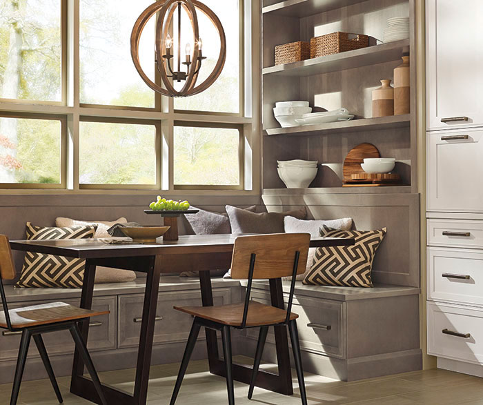 Dining area of a casual open kitchen design by Kitchen Craft Cabinetry