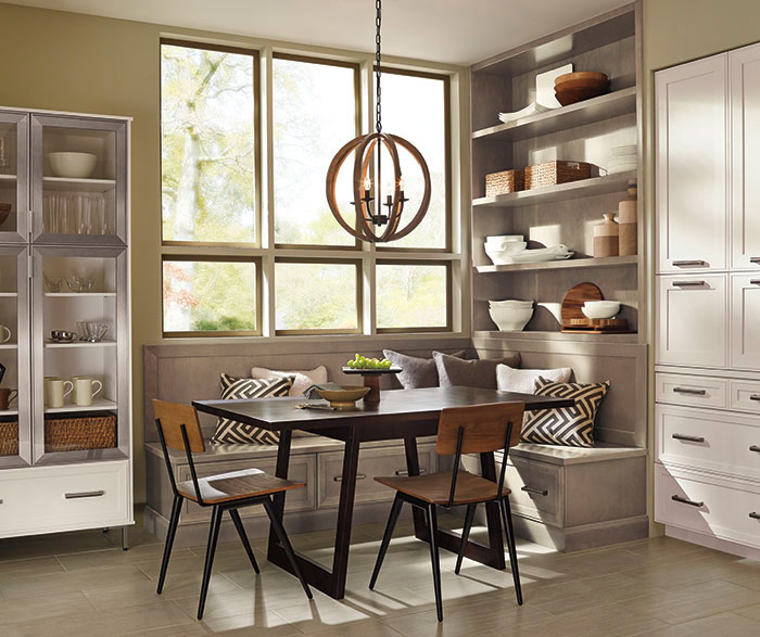 Dining area of casual open kitchen design by Kitchen Craft Cabinetry